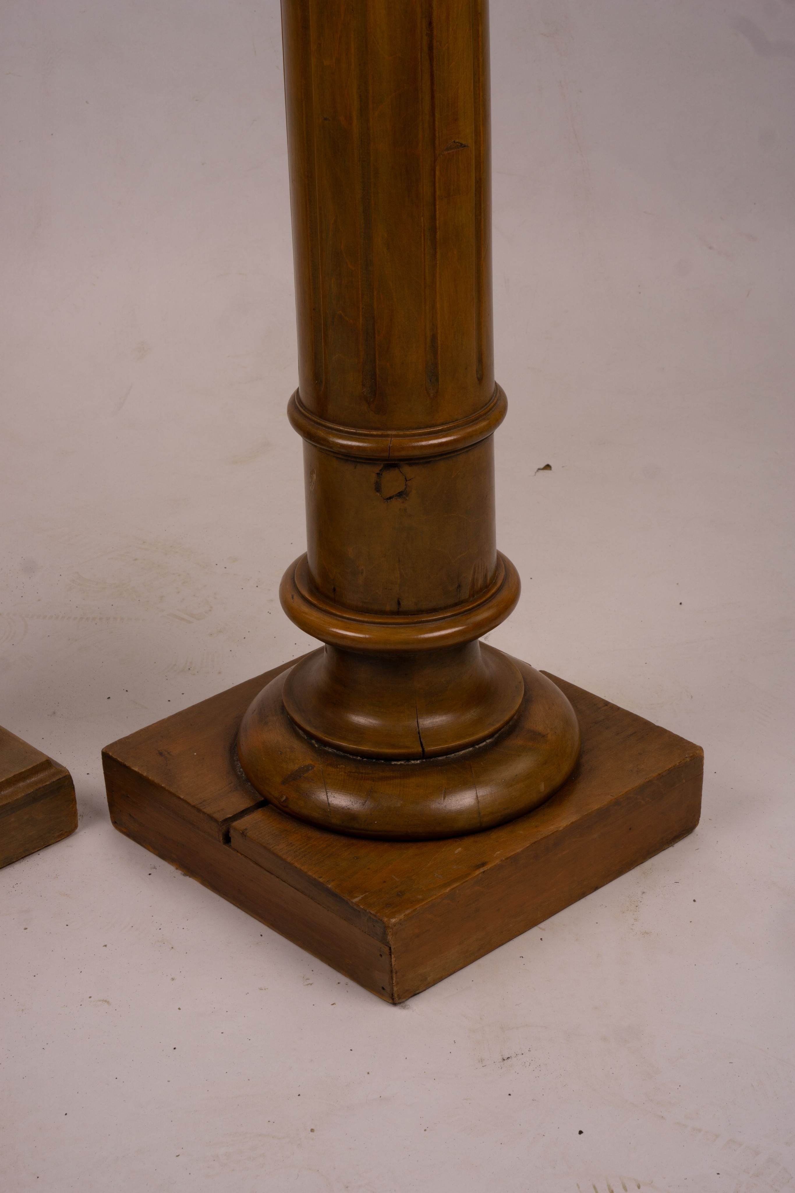 A pair of Victorian style carved beech and walnut pedestals, height 110cm